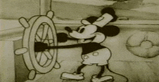 Mickey Mouse whistling at the wheel in Steamboat Willie