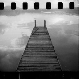 Misty bridge with a perfect reflection